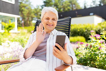 Image showing happy senior woman with phone having video call