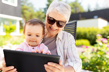 Image showing grandmother and baby granddaughter with tablet pc