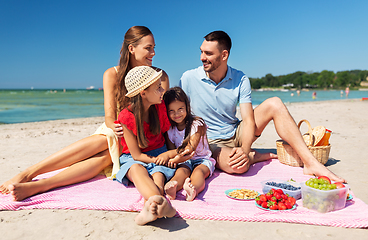 Image showing happy family having picnic on summer beach