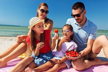 Image showing happy family having picnic on summer beach