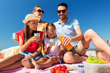 Image showing happy family having picnic on summer beach