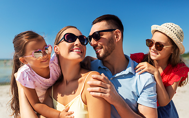 Image showing happy family in sunglasses on summer beach