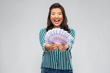Image showing asian woman with money banknotes of thousands euro
