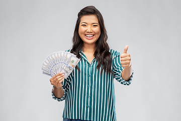 Image showing asian woman with hundred dollar money banknotes