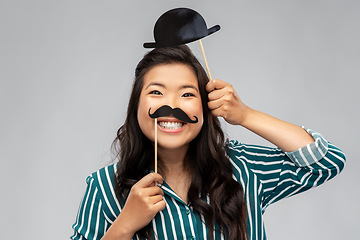 Image showing asian woman with vintage moustaches and bowler hat