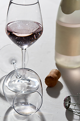 Image showing wine glasses and champagne bottle dropping shadows