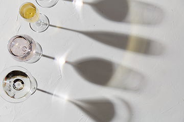 Image showing wine glasses dropping shadows on white surface