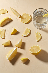 Image showing glass of water and lemon slices on table