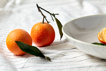 Image showing still life with mandarins on plate over drapery