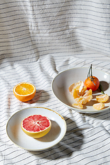 Image showing still life with mandarins and grapefruit on plate