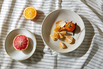 Image showing still life with mandarins and grapefruit on plate