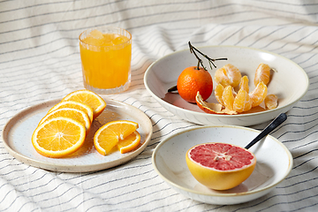 Image showing mandarin, grapefruit and glass of orange juice