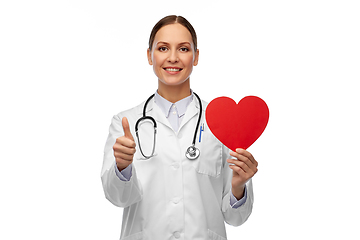 Image showing smiling female doctor with heart showing thumbs up