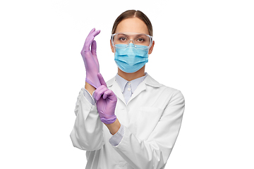 Image showing female doctor in gloves, mask and goggles