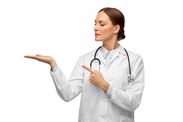 Image showing female doctor holding something on her hand