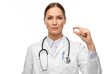 Image showing female doctor holding medicine pill