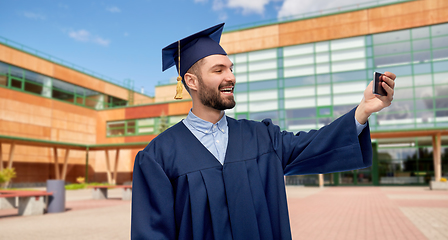 Image showing male graduate student with smartphone takes selfie