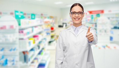 Image showing female pharmacist showing thumbs up at pharmacy