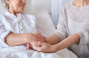 Image showing adult daughter visiting senior woman at hospital