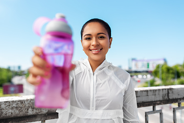 Image showing african american woman drinking water from bottle