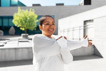 Image showing african american woman doing sports outdoors