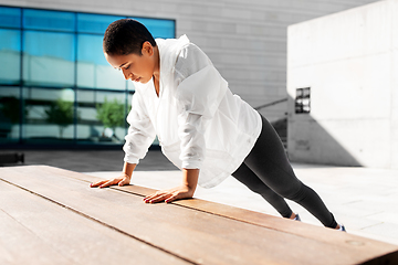 Image showing african american woman doing sports outdoors