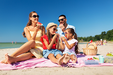 Image showing happy family having picnic on summer beach