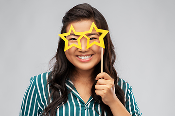 Image showing happy asian woman with star-shaped party glasses