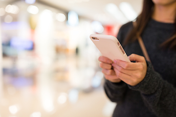 Image showing Woman working on cellphone