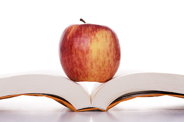 Image showing apple over a open book