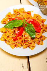 Image showing Italian pasta farfalle butterfly bow-tie and tomato sauce