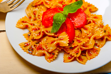 Image showing Italian pasta farfalle butterfly bow-tie and tomato sauce