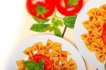 Image showing Italian pasta farfalle butterfly bow-tie and tomato sauce