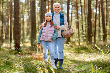 Image showing grandmother and granddaughter picking mushrooms