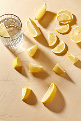 Image showing glass of water and lemon slices on table