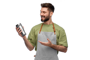 Image showing happy waiter with tumbler or takeaway thermo cup