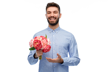 Image showing happy smiling man with bunch of flowers