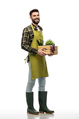 Image showing happy gardener or farmer with box of garden tools