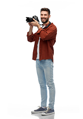 Image showing smiling man or photographer with digital camera