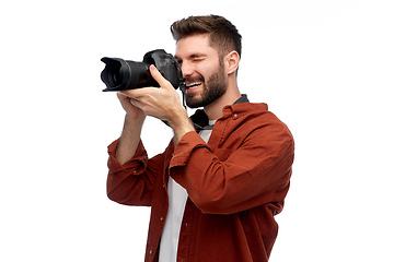 Image showing smiling man or photographer with digital camera