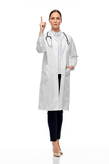 Image showing female doctor with stethoscope pointing finger up