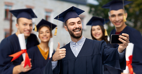 Image showing graduate students with smartphone taking selfie