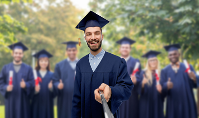 Image showing male graduate student taking selfie with monopod