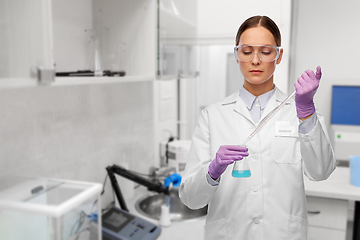 Image showing female scientist with chemical at laboratory