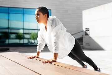 Image showing african american woman doing sports outdoors