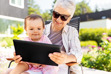 Image showing grandmother and baby granddaughter with tablet pc