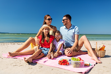 Image showing happy family having picnic on summer beach