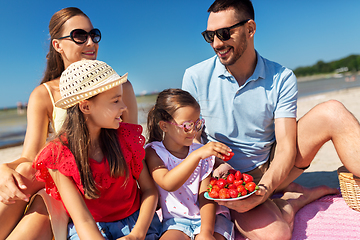 Image showing happy family having picnic on summer beach