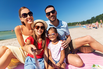 Image showing happy family taking selfie on summer beach