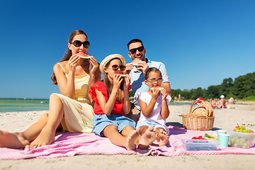 Image showing happy family having picnic on summer beach